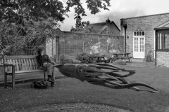 man on bench with squid